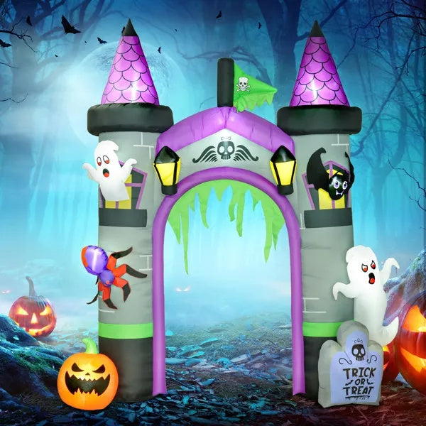 Giant inflatable Halloween archway lit up over a driveway