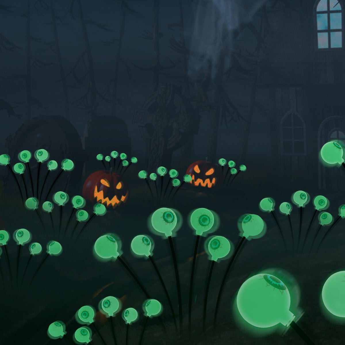 Green solar eyeball path lights glowing in a graveyard scene with lit pumpkins at night