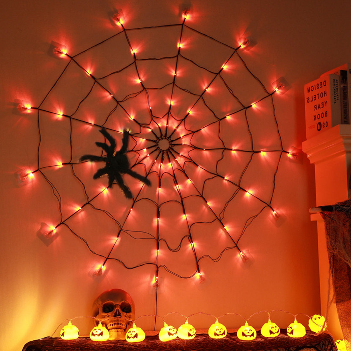 LED spider web light with hairy spider glowing on an exterior wall