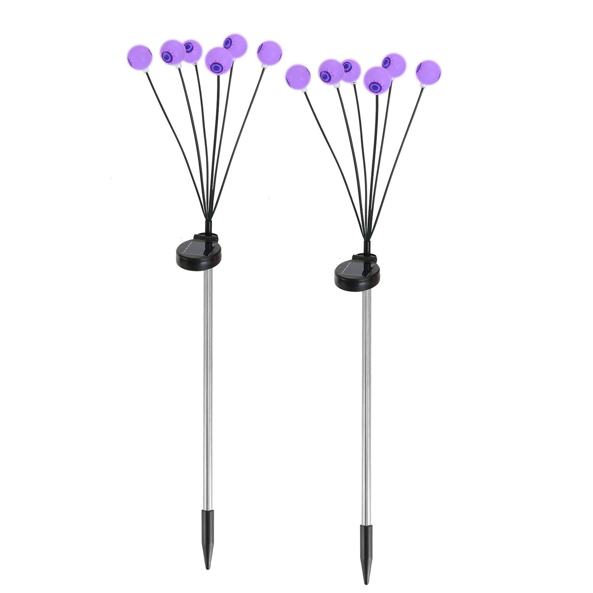 Pair of solar eyeball path lights staked along a garden walkway