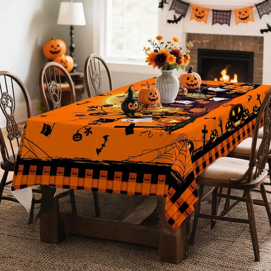 Halloween tablecloth with pumpkins and ghosts on a dining table